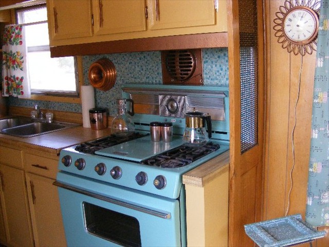 She boasts a full kitchen with original turquoise oven...
